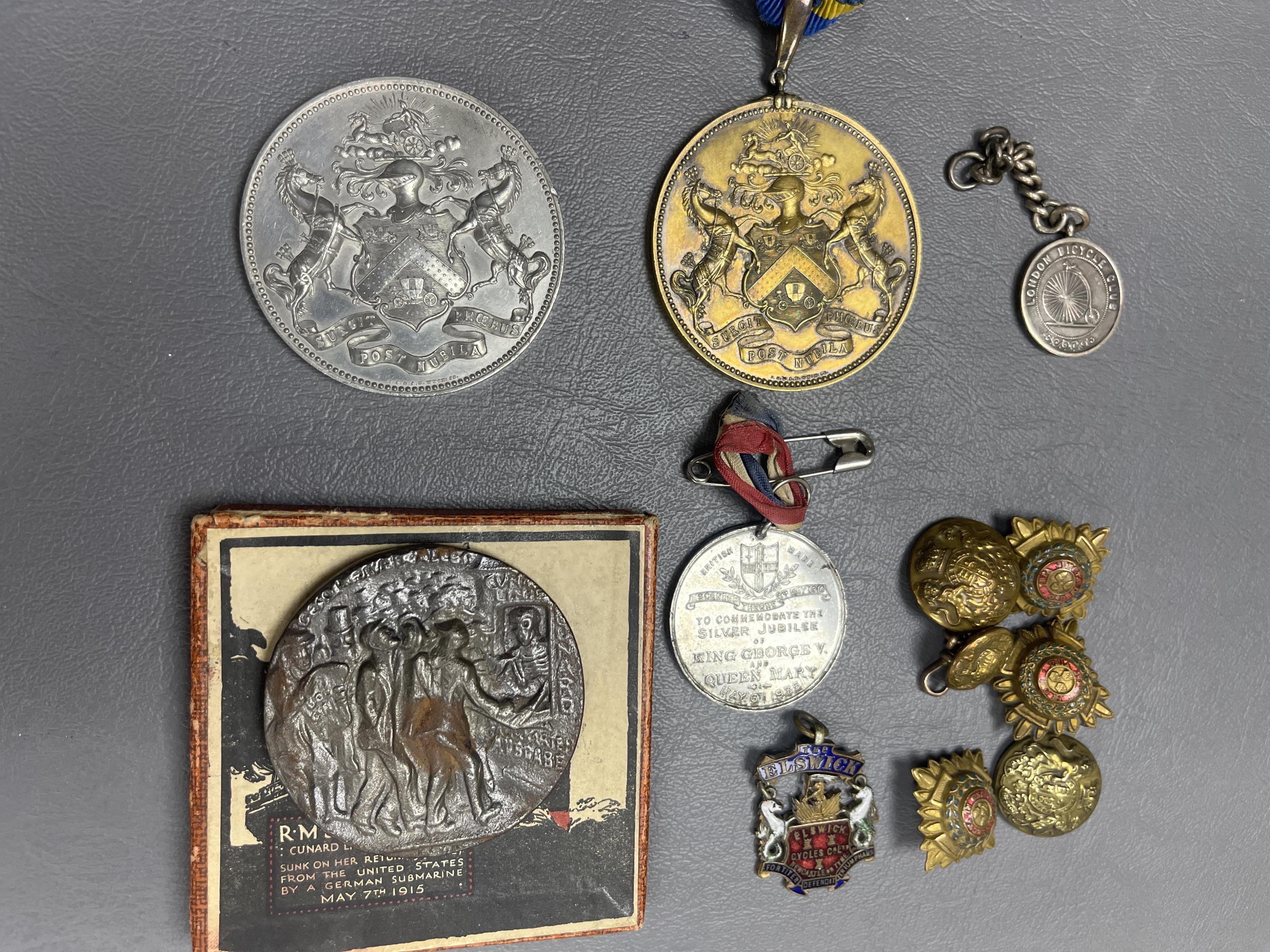 A silver gilt medallion - 'Worshipful Company of Coachmakers and Coach harness makers', engraved 1865-1866 etc, on a suspension link and ribbon, another, in base metal, with a blank recipient field, A London bicycle club